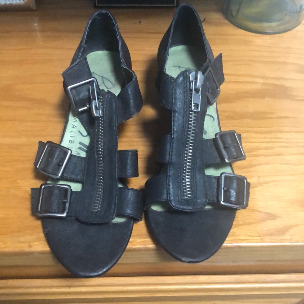 Wedge sandals by Blowfish. Zipper front. Side entry with buckle.